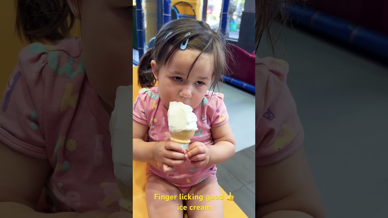 Mia licking ice cream 