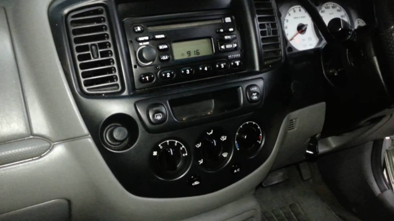 How to remove the factory radio from a Ford Escape/ Mazda Tribute - YouTube