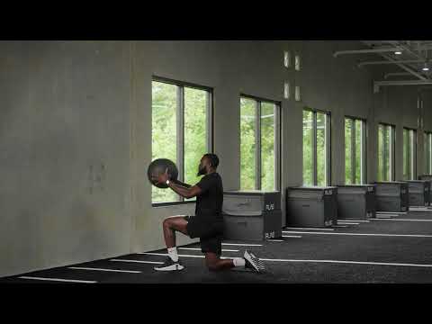 Half Kneeling Forward Facing Medicine Ball Hip Toss Rotating to Up Knee Exercise