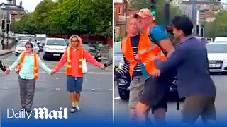 Enraged motorist pushes Just Stop Oil out of road while cars circumvent slow march