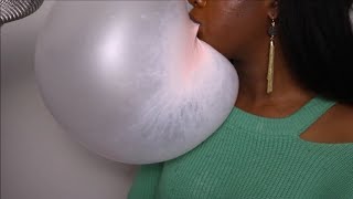 Woman Blows Massive Bubbles With Gum