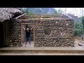 Primitive skills build stone house  build log cabin with many stones in the mountain