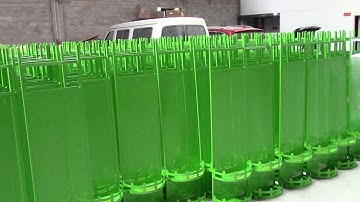 Metal pegboard display rack with hooks.