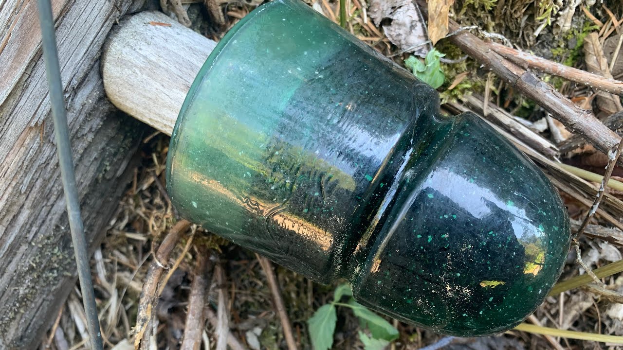 Insulator hunting old Vermont railroad