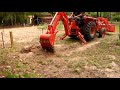 Kubota backhoe digging for water line