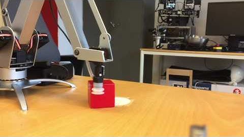 Reinforcement learning for pushing a cube with a uArm robot.