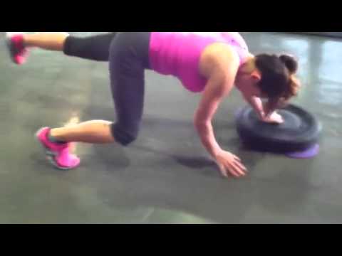 Bear crawl with weight plate