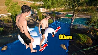 INSANE DIY HOMEMADE 60 MPH WATER SLIDE!! *WORLD RECORD*