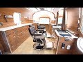 Airstream Bus Transformed Into Mobile Barbers