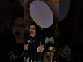 Man is playing dubstep on a tuba with a game controller!