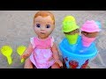 Baby doll playing with ice cream toys on the Playground. Video for kids