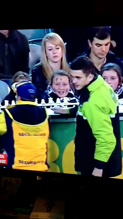 Girl who makes racist remark towards Adam Goodes gets escorted out of the MCG.