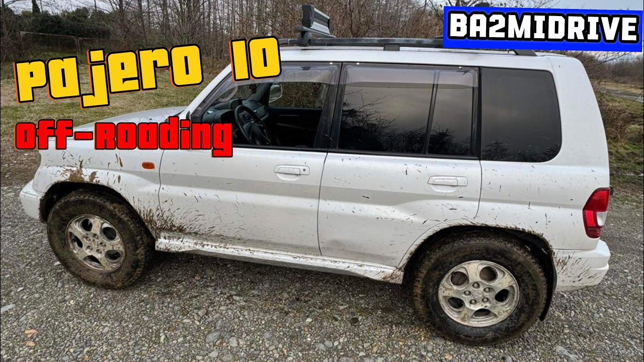 2000 Mitsubishi Pajero IO off-road drive on sand beach in seaside town 4K