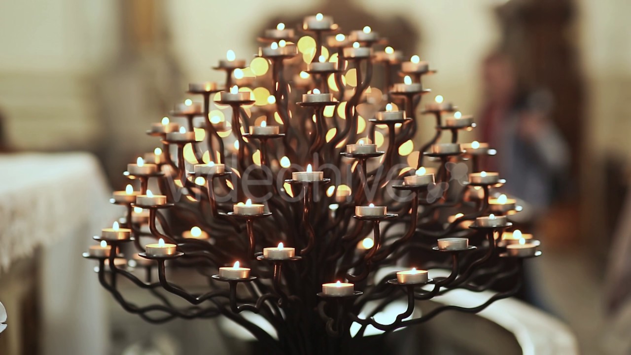 In the Catholic Church burning candles on a stand YouTube