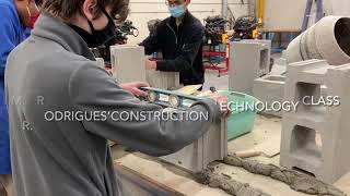 Laying concrete blocks Philip Pocock construction technology class.