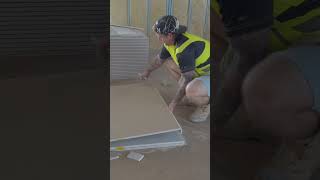 Construction worker shows how to cut drywall straight with a knife