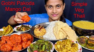 Gobhi Pakoda Aloo Bhorta Mango Dal Chawal Bhindi Fry,Baingan Fry,Karela Fry,Aloo Fry,ParwalFryEating