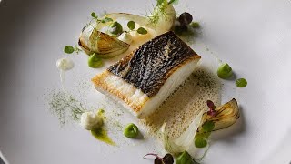Pan-Seared Sea Bass With Charred Fennel, Green Pea Purée, And Champagne Foam