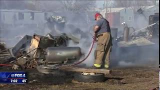 Man welding in yard sparks Palmer brush fire