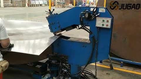 Dish end forming machine with automatic cutting and flanging functions.