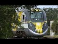 15 hurt when passenger train strikes fire truck that drove into crossing after freight train passed