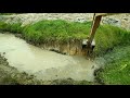 Escavadeira hidráulica CAT 312D reabrindo rio que dezagua na lagoa Op GALEGO CAPIXABA