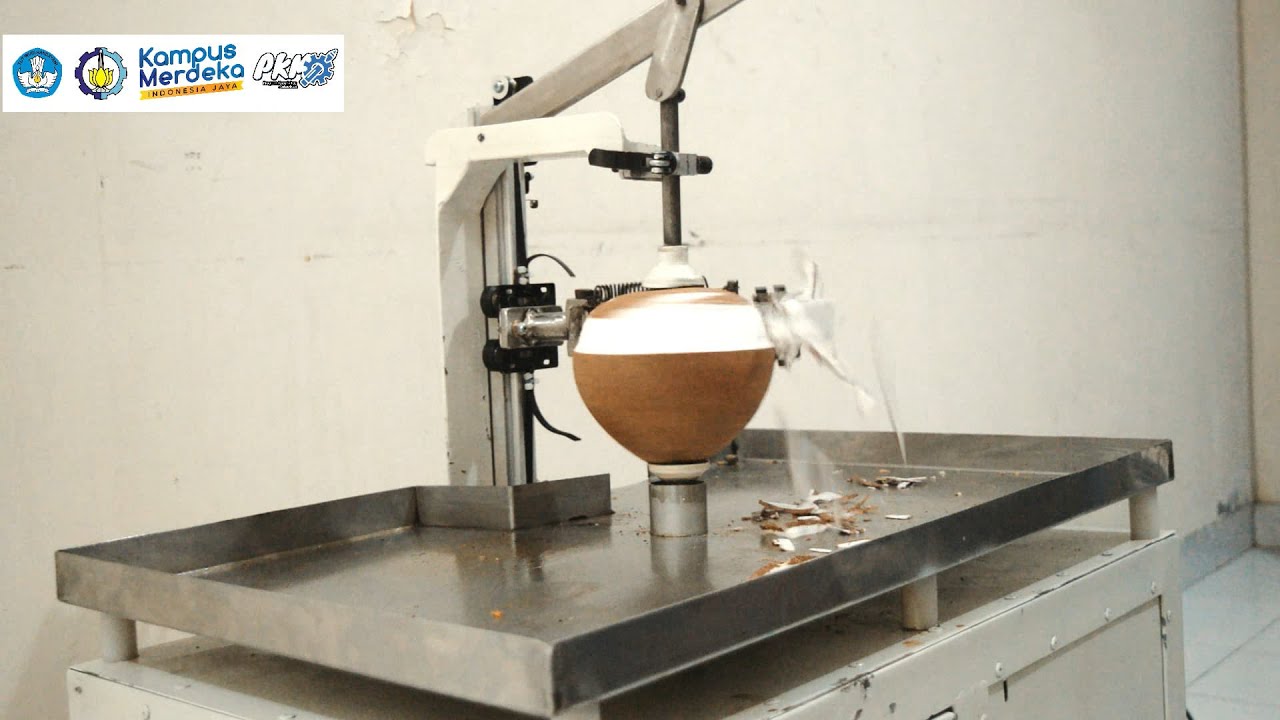PKM KI ITS 2021 : Inovasi Mesin Pengupas Kulit Ari Kelapa Otomatis Berbasis PLC