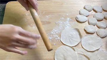 Rolling out dumpling wrappers