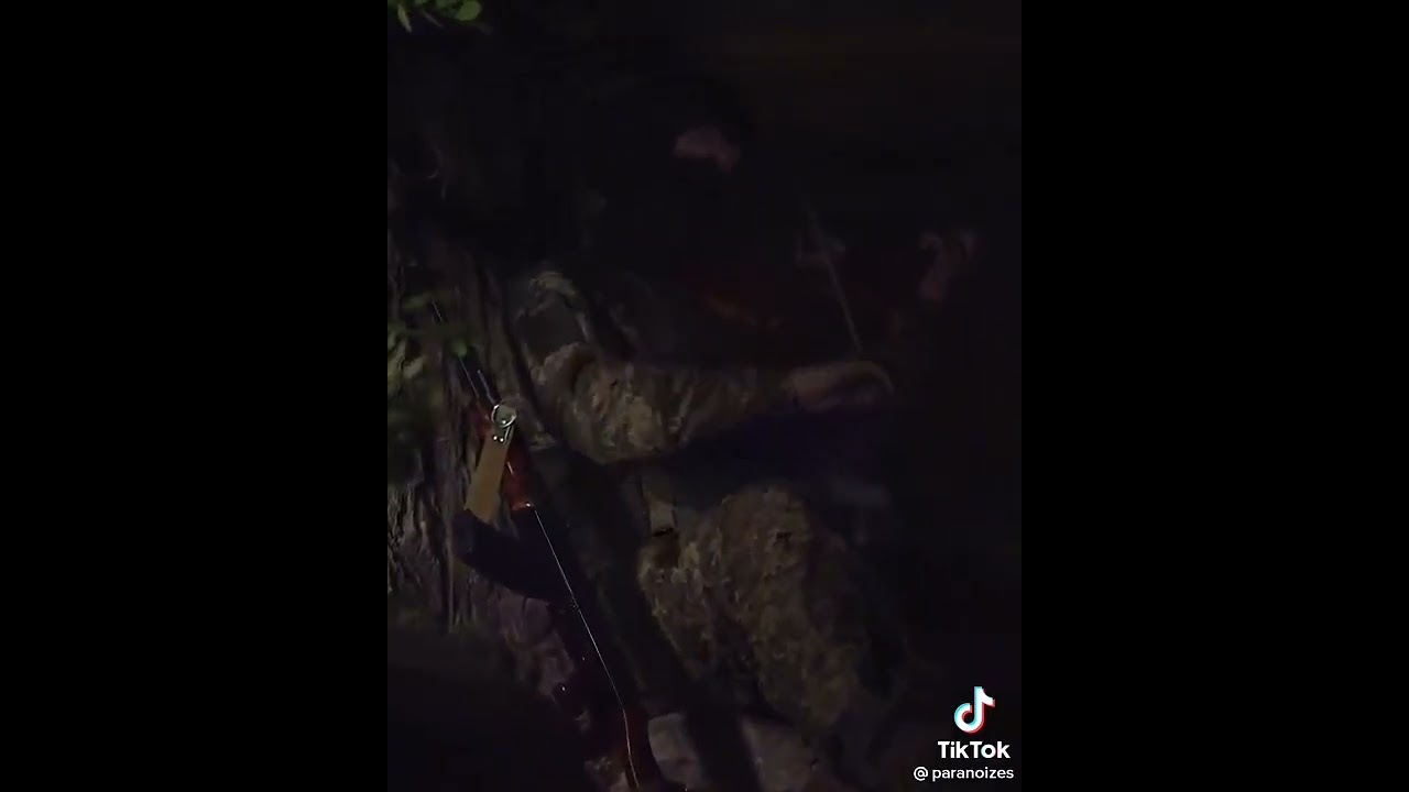 Ukraine - XX.07.2022. Ukrainian Soldier Playing Violin In The Trench.