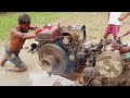 Engine fitting standing in the mud on a rainy day.| China power tiller engine fitting.|