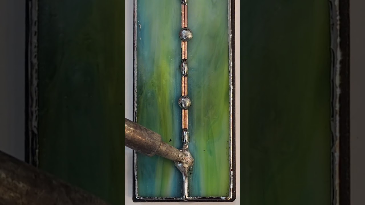 Finishing a custom ordered stained glass piece. Fishing product at the end! 