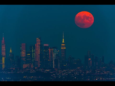 TimeLapse Video - September full moon rises behind the Empire State Building in New York City.