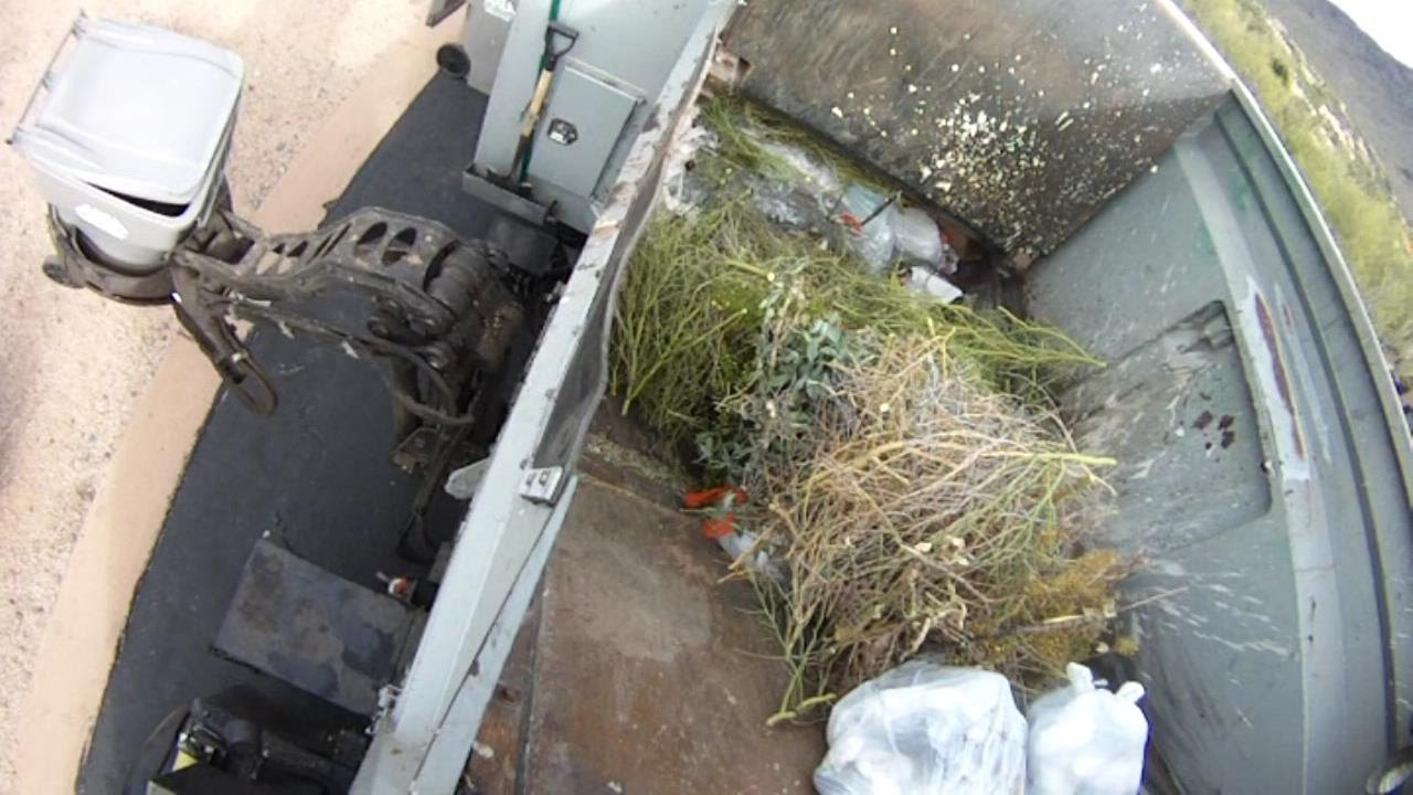 Curbside Hopper Video of a McNeilus AutoReach Garbage Truck