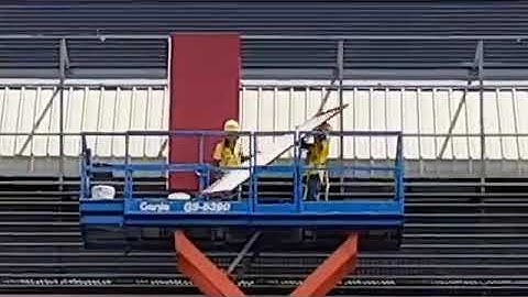 Workers remove the cladding on 3, Pioneer Sector 3