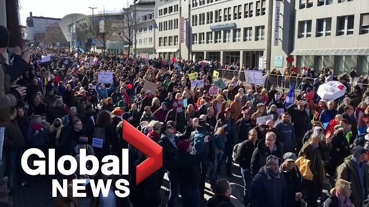 UK police scuffle with anti-lockdown protesters as thousands march in Germany, Austria