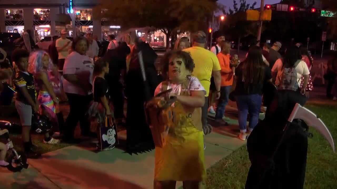 Halloween comes early at annual ‘Trick or Treat on Travis Street’ - YouTube