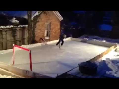 Squirt Hockey Player Working On His Skills On Backyard Ice Rink