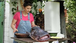 In the village, they prepared a soup from the head of a catfish according to a special recipe.