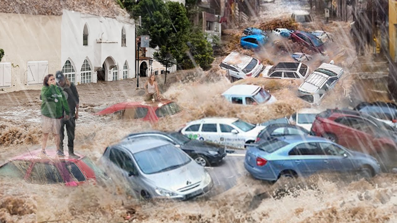 Emergency Evacuation in Spain! People climb onto cars to escape the