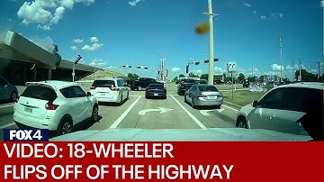 Video shows 18-wheeler falling from overpass in fiery crash