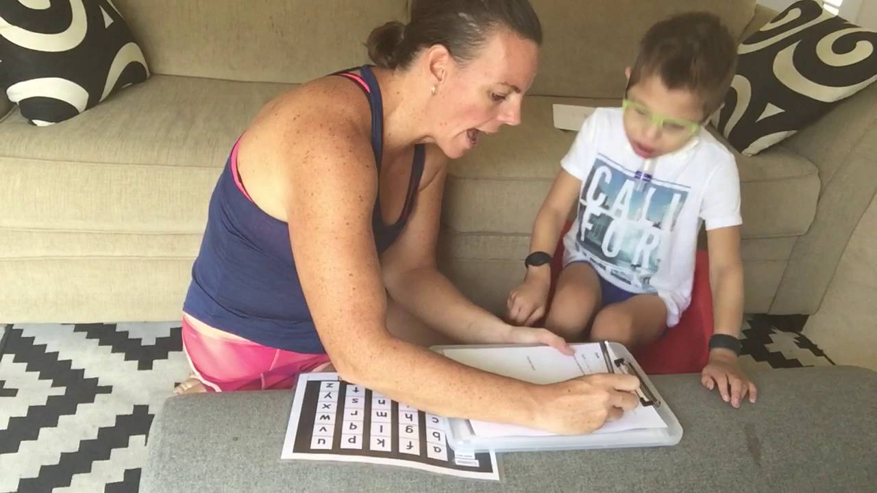 Jayden writing using PODD and alternative pencil