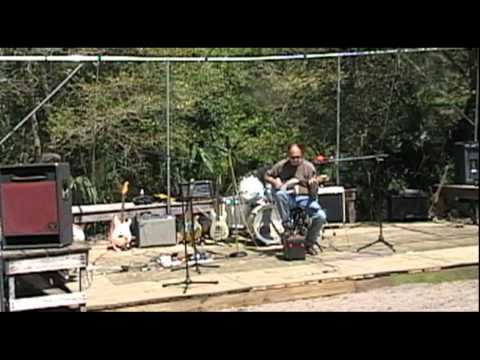 Jeff DeHollander tries the "Concrete block" guitar...