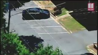 Woman found dead in car outside Marietta apartment complex