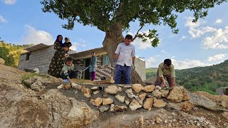 Construction of the courtyard of the house with hand-made stone facades