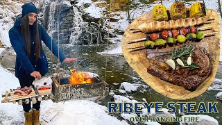 Cooking Ribeye steak on fire | DIY hanging wooden grill | Solo winter bushcraft near the waterfall
