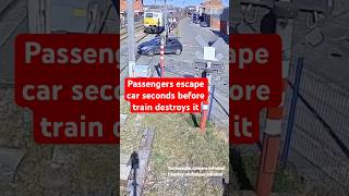 Close call as car passengers escape seconds before train smashes into car