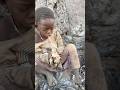 Tuyetuye Busy Enjoying Baboon Intestine In The Bush