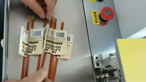 Honey stick label applicator machine