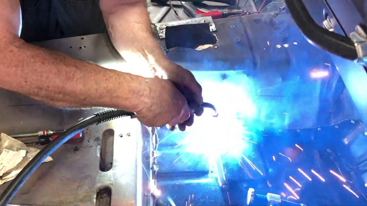 Welding in new floor panels YouTube