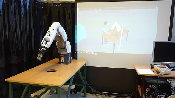 Human-Robot Collaboration: Task sharing through Virtual Reality